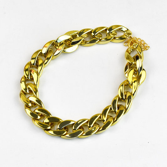Gold Cuban-link dog chain on white background