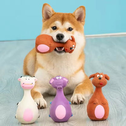 Small dog with a squeaky latex toy and three more toys from the 4-pack